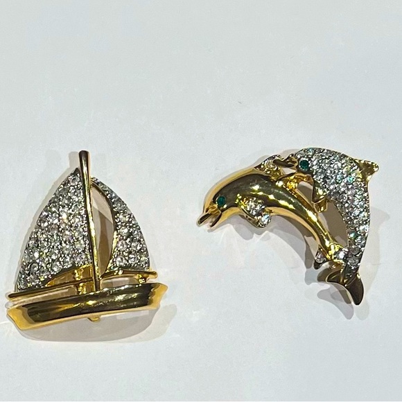 Jewelry - Vintage pair of gold-toned with rhinestone encrusted brooches. .